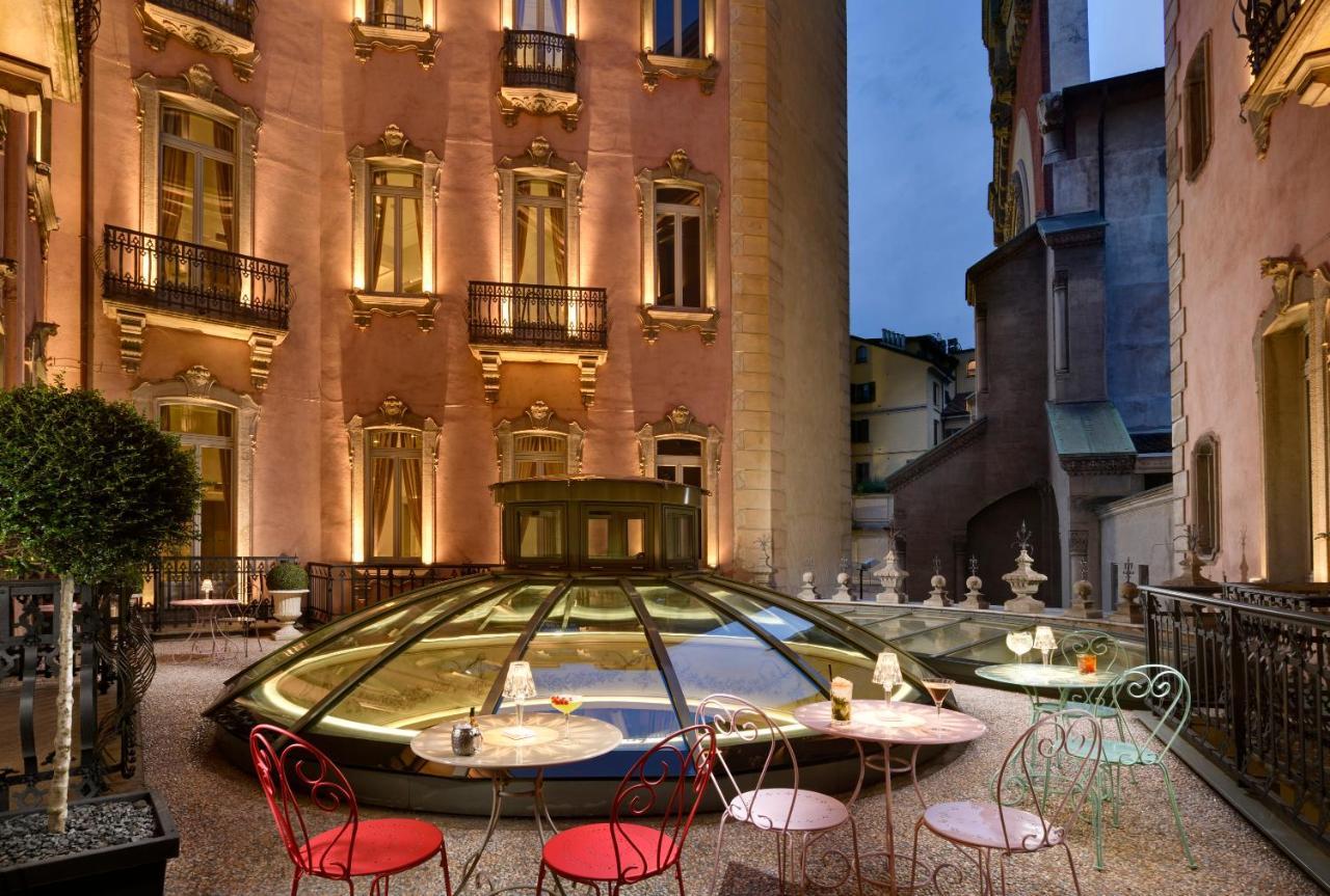 Chateau Monfort - Relais & Chateaux Milán Exterior foto The hotel's courtyard